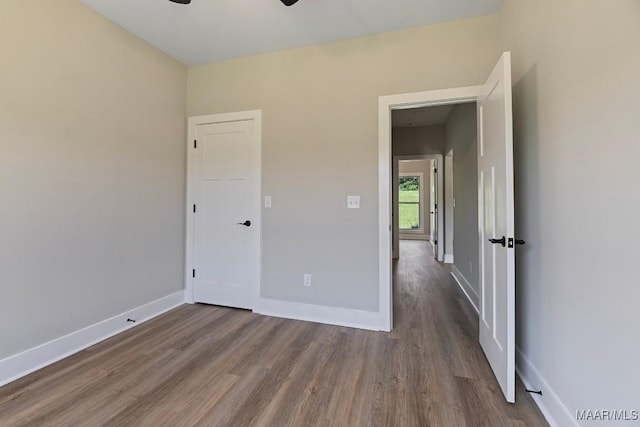 116 Madix Dr, Eclectic, AL 36024 - unfurnished bedroom with dark wood-style flooring and baseboards