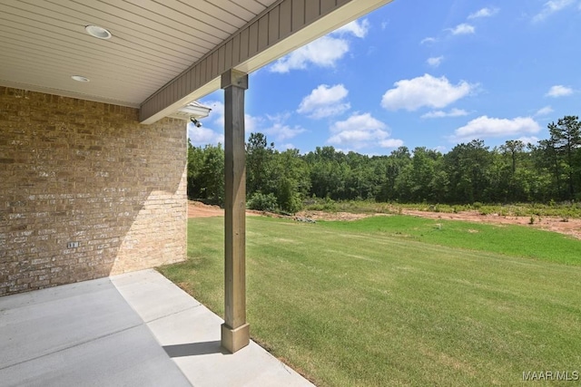 116 Madix Dr, Eclectic, AL 36024 - view of green lawn with a patio