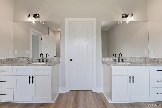 116 Madix Dr, Eclectic, AL 36024 - bathroom with wood finished floors and two vanities