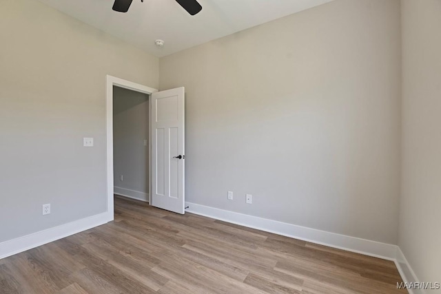 116 Madix Dr, Eclectic, AL 36024 - empty room with ceiling fan, wood finished floors, and a smoke detector