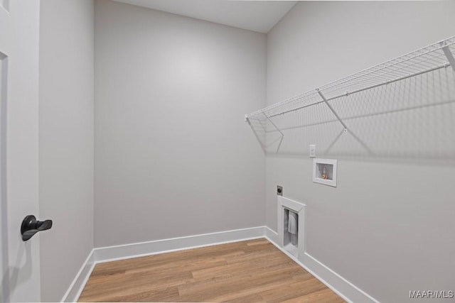 116 Madix Dr, Eclectic, AL 36024 - laundry area featuring washer hookup, light wood-style floors, and hookup for an electric dryer