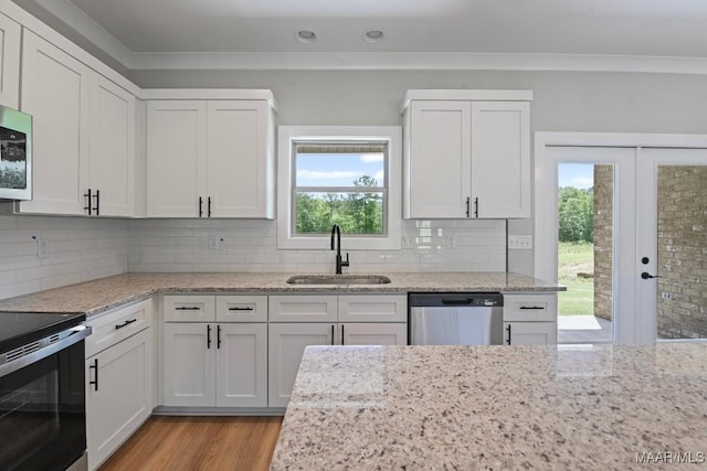 116 Madix Dr, Eclectic, AL 36024 - kitchen featuring appliances with stainless steel finishes, light wood-style floors, white cabinetry, light stone countertops, and recessed lighting