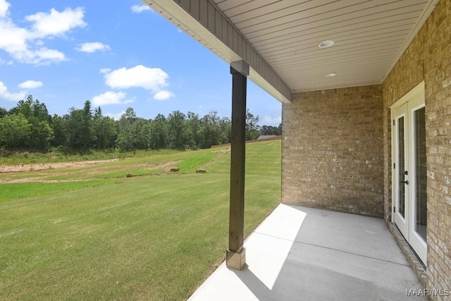 116 Madix Dr, Eclectic, AL 36024 - view of grassy yard featuring a patio