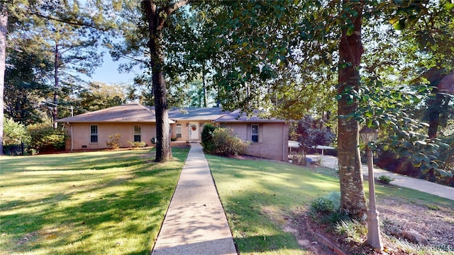 ranch-style home with a front lawn