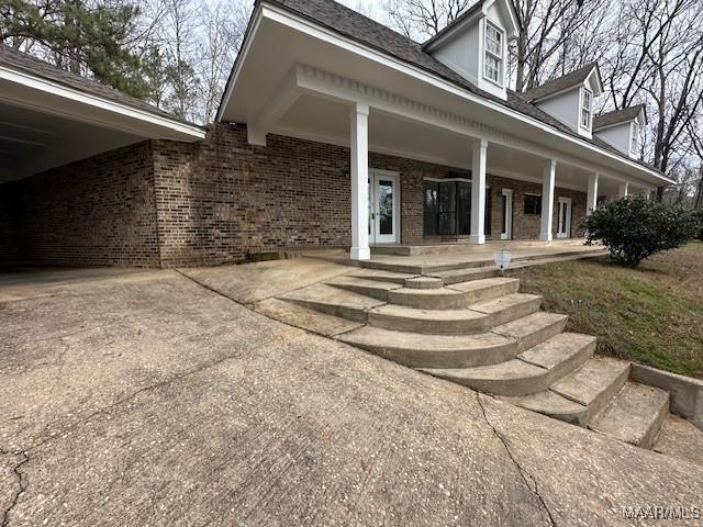 doorway to property with a porch