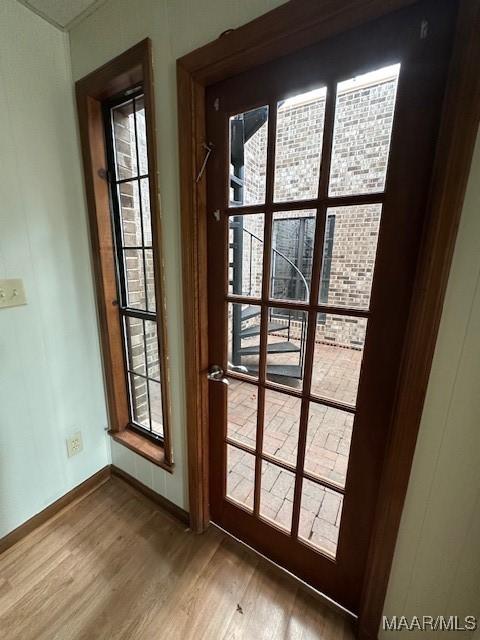 doorway with wood-type flooring