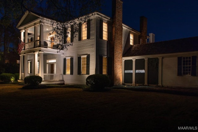 view of front of property with a balcony