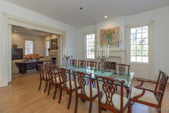 dining space with a healthy amount of sunlight and light wood-type flooring