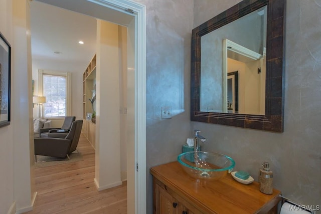 bathroom with vanity and hardwood / wood-style floors