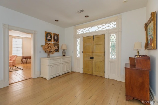 entrance foyer featuring light hardwood / wood-style floors