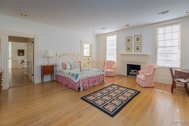 bedroom with hardwood / wood-style flooring