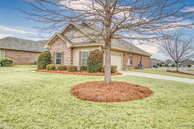 view of front of home featuring a garage, a front lawn, and central air condition unit