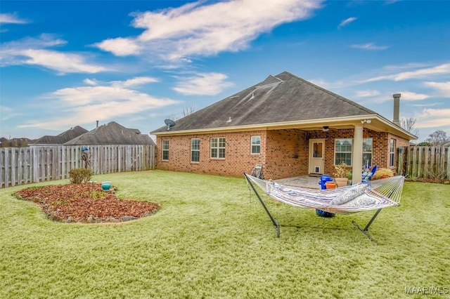 back of house with a patio, a yard, and ceiling fan