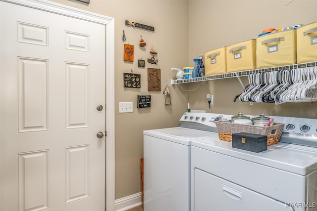 washroom featuring washer and clothes dryer