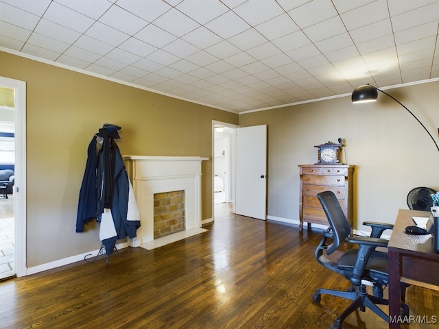 office area with crown molding and dark wood-type flooring