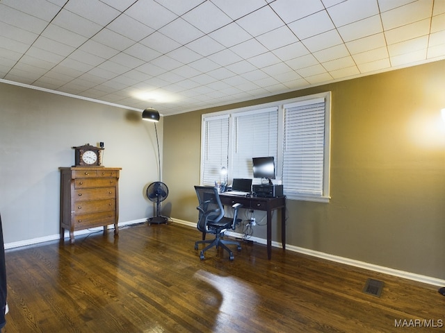 home office with dark hardwood / wood-style flooring and crown molding