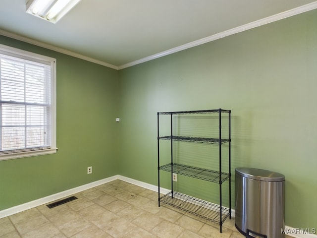 spare room featuring crown molding