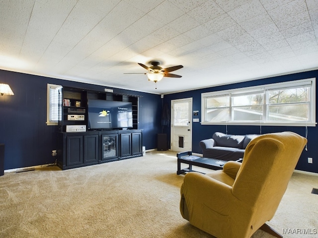 carpeted living room featuring ceiling fan