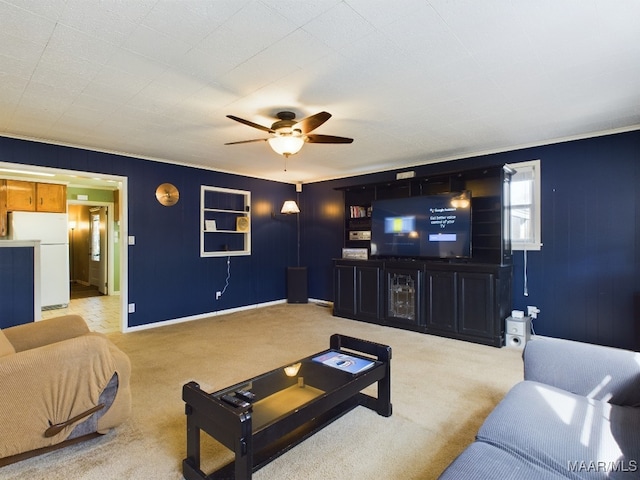 living room with ceiling fan and light colored carpet