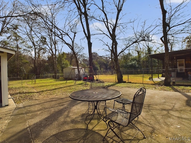 view of patio with a storage shed