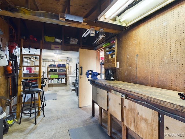 interior space with concrete flooring and a workshop area