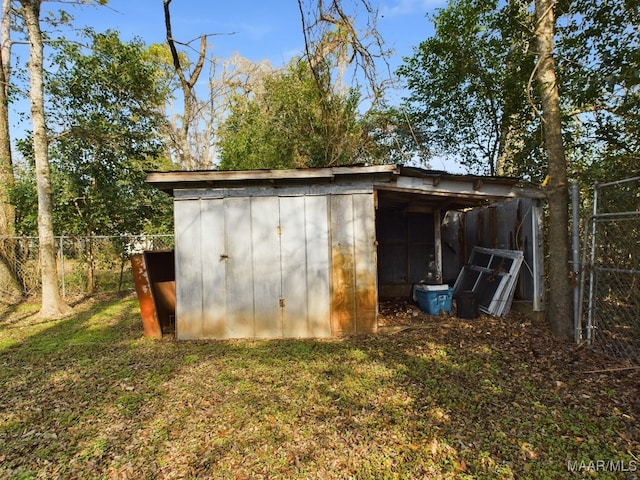 view of outbuilding featuring a yard