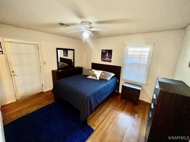 bedroom with hardwood / wood-style flooring and ceiling fan