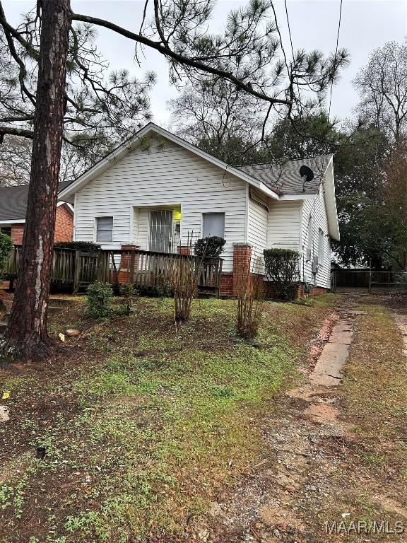 back of house with a wooden deck