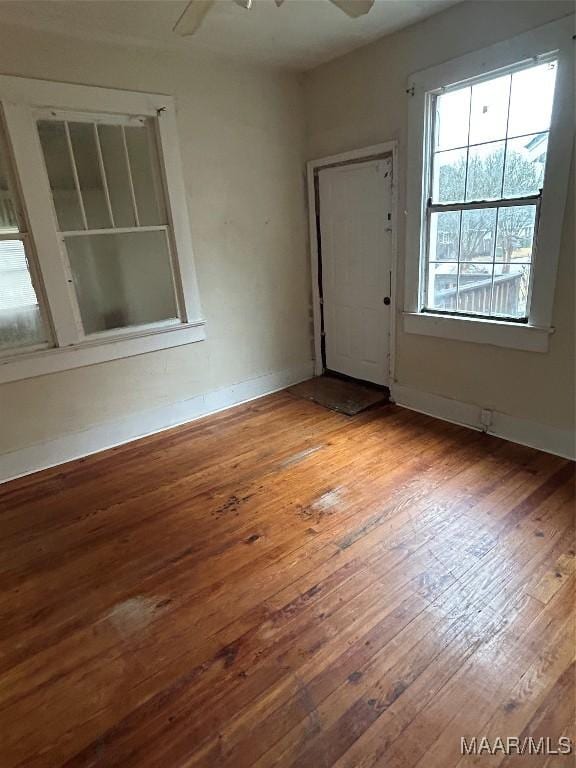 spare room featuring ceiling fan and light wood-type flooring