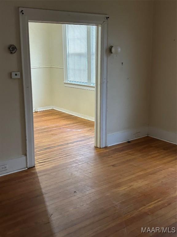 unfurnished room featuring light hardwood / wood-style flooring