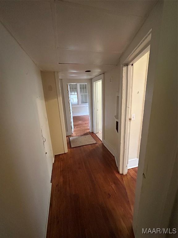 hall with dark hardwood / wood-style floors