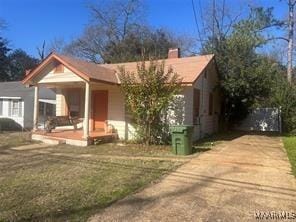2303 Mccarter Ave, Montgomery, AL 36107 - view of front of home with a front lawn and covered porch