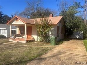 view of front of home with a front lawn and covered porch