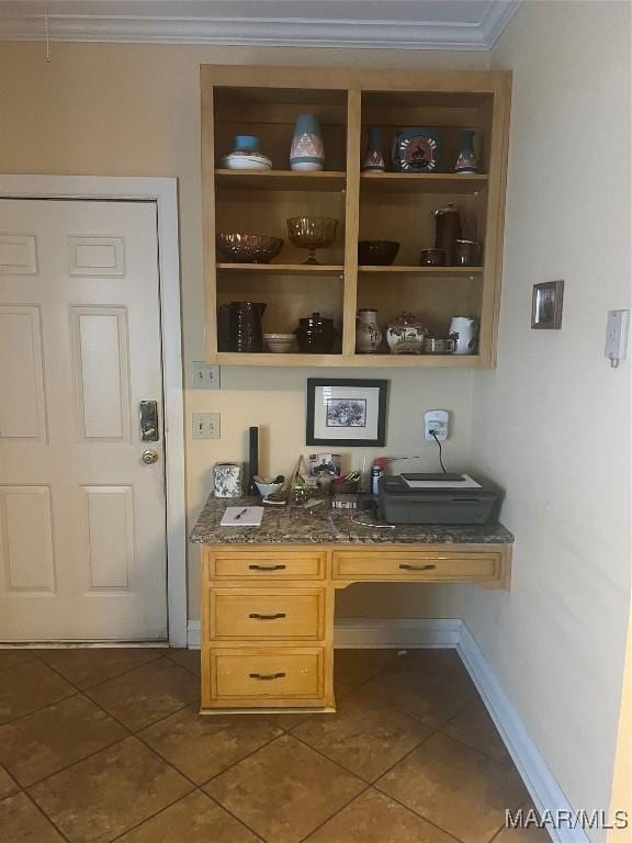 tiled home office with ornamental molding and built in desk