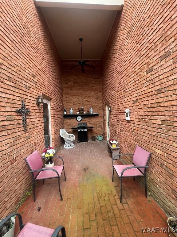 view of patio / terrace featuring area for grilling and ceiling fan