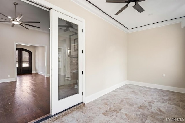 spare room with ornamental molding, french doors, and ceiling fan