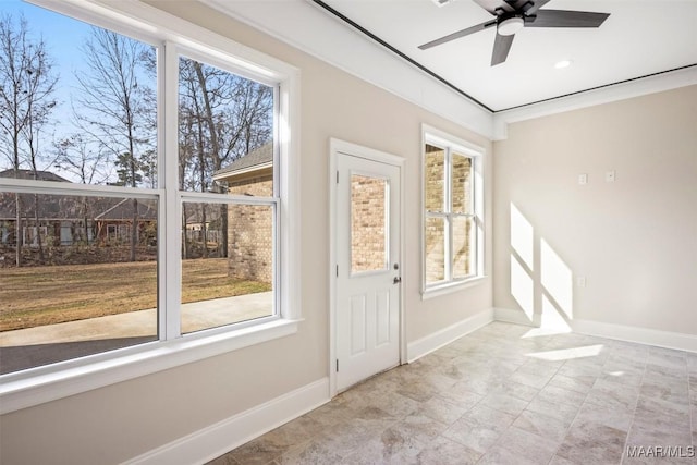 entryway featuring crown molding and ceiling fan