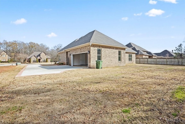 view of home's exterior featuring a yard and a garage