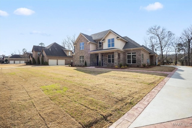 view of front of home featuring a garage and a front lawn