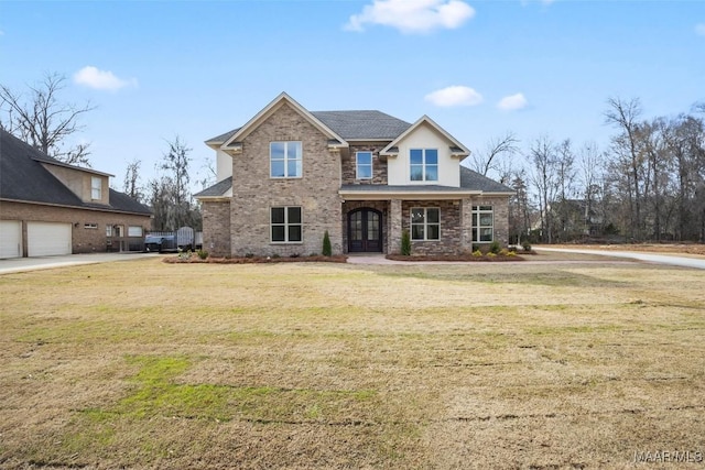 view of front facade featuring a garage and a front yard