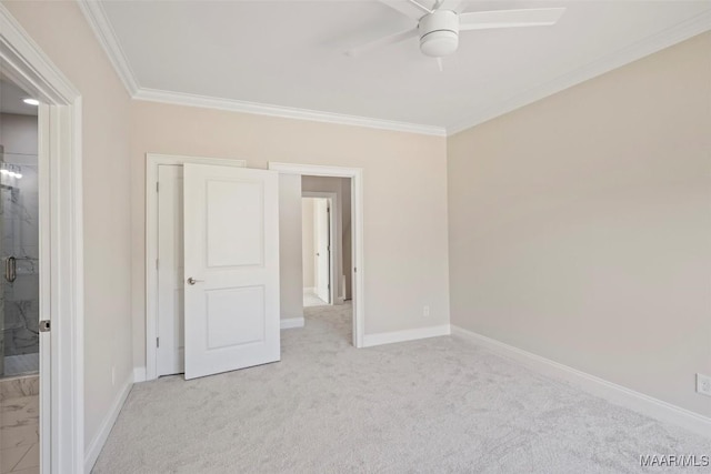 unfurnished bedroom with ceiling fan, ornamental molding, ensuite bath, and light carpet