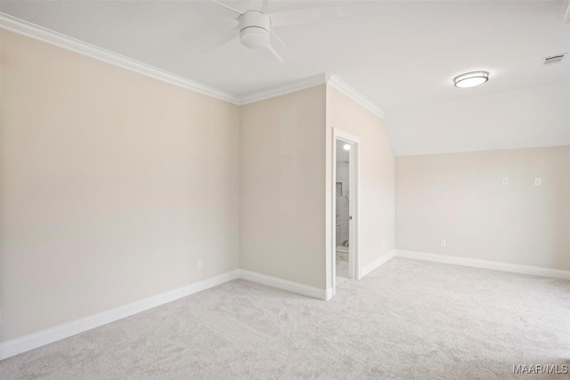 unfurnished room with crown molding, vaulted ceiling, light colored carpet, and ceiling fan