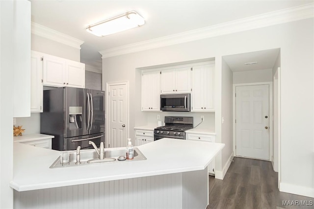 kitchen featuring white cabinetry, ornamental molding, stainless steel appliances, and kitchen peninsula