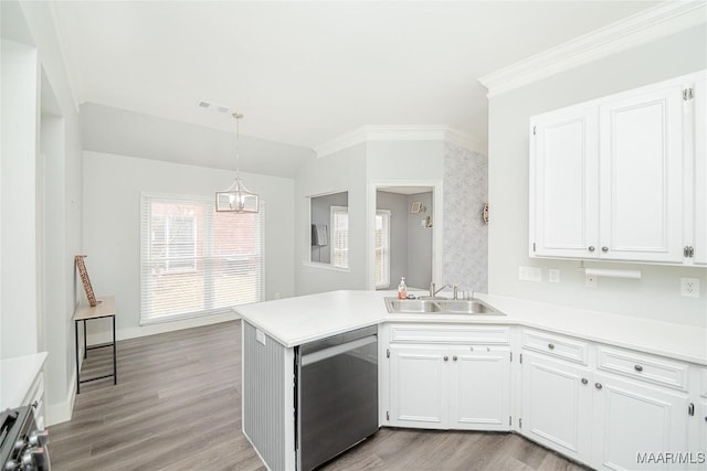 kitchen featuring sink, white cabinetry, hanging light fixtures, dishwasher, and kitchen peninsula