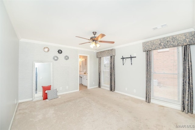 empty room with crown molding, light colored carpet, and ceiling fan