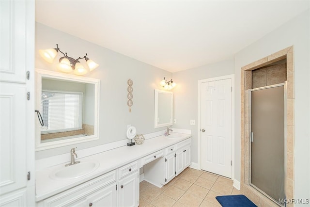 bathroom featuring a shower with door, vanity, and tile patterned flooring