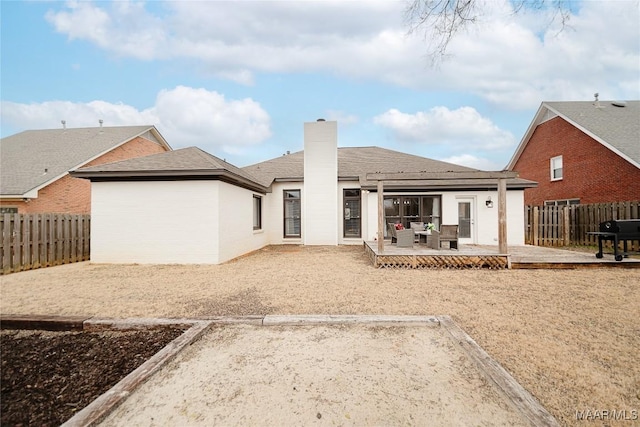 back of property with a patio