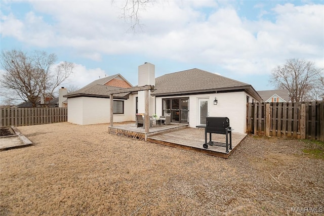 rear view of house with a deck