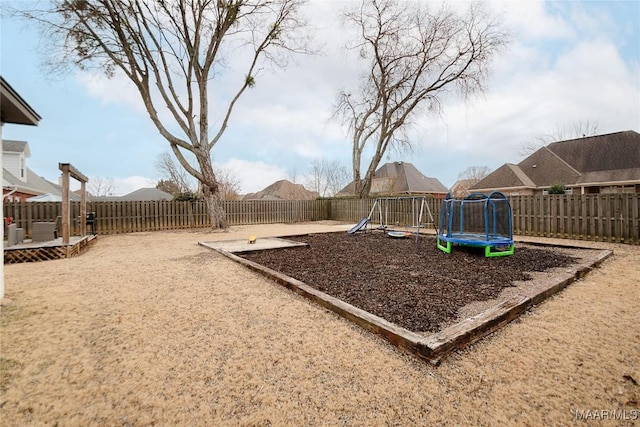 view of jungle gym featuring a trampoline