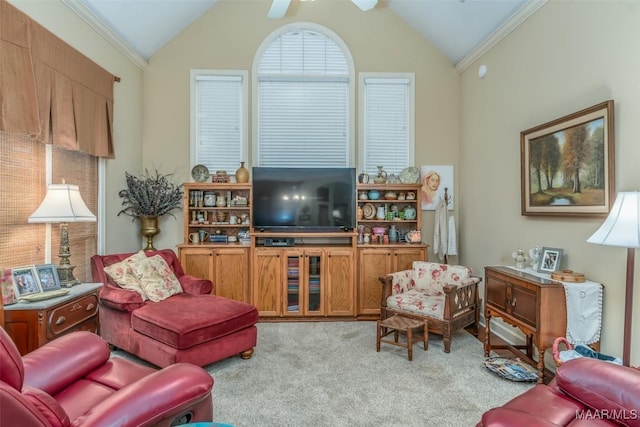 carpeted living room featuring crown molding, ceiling fan, and lofted ceiling